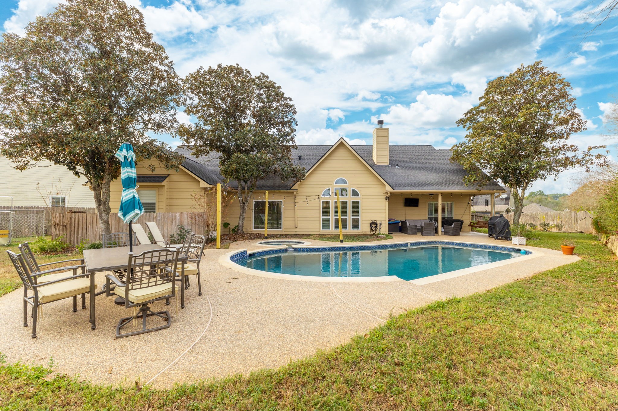 2709 Chase Street Brenham, TX 77833 - Photo 38 of 43 a view of house with swimming pool and sitting area