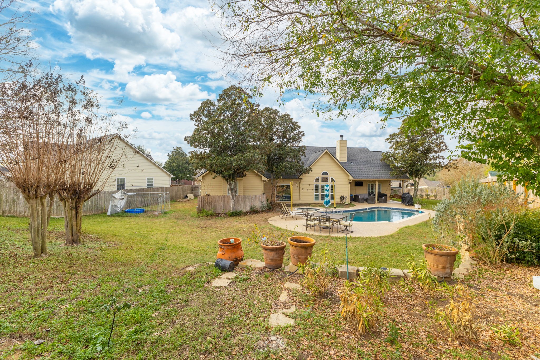 2709 Chase Street Brenham, TX 77833 - Photo 39 of 43 a view of a house with swimming pool and sitting area