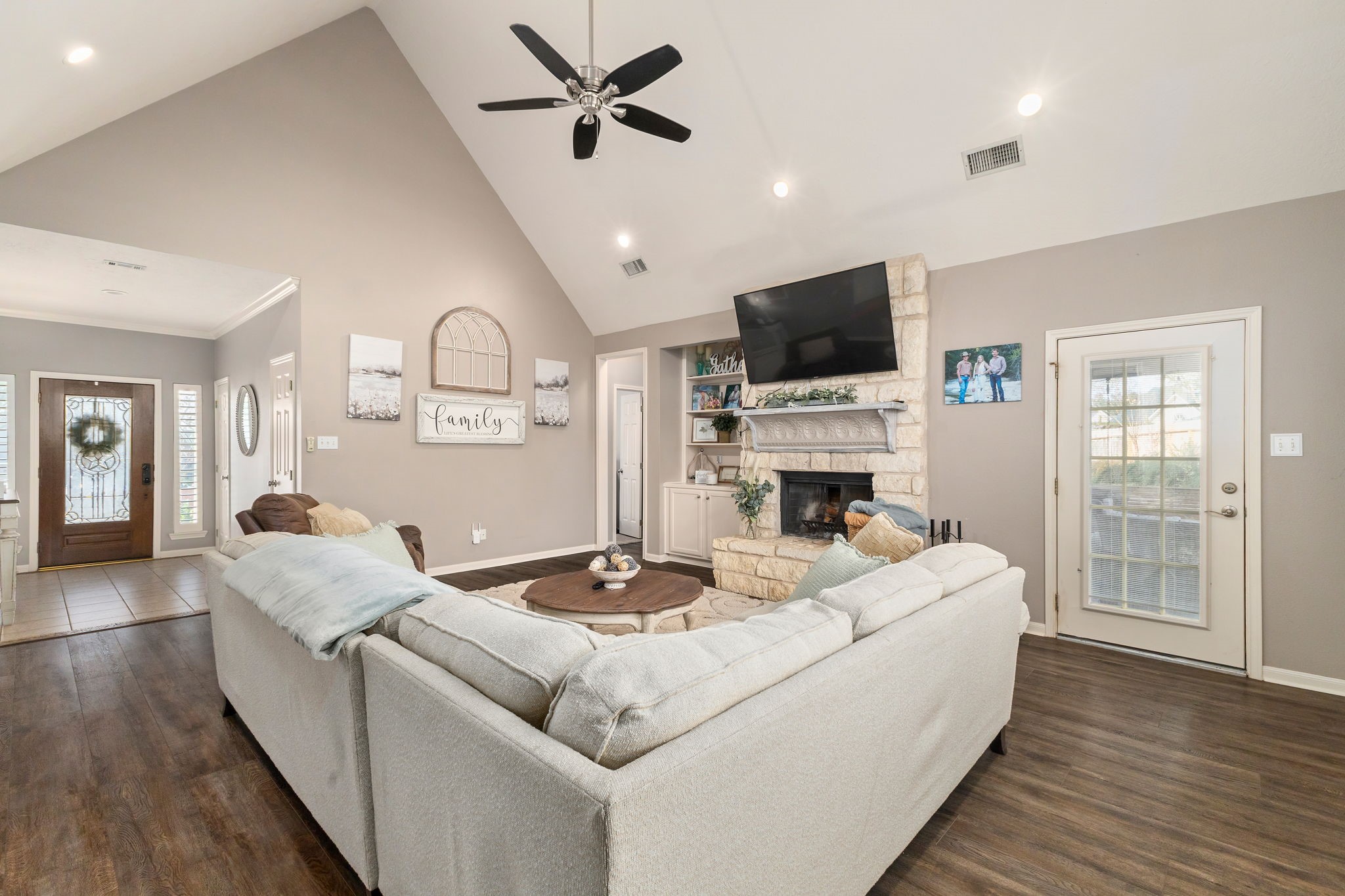 2709 Chase Street Brenham, TX 77833 - Photo 7 of 43 a living room with fireplace furniture and a flat screen tv