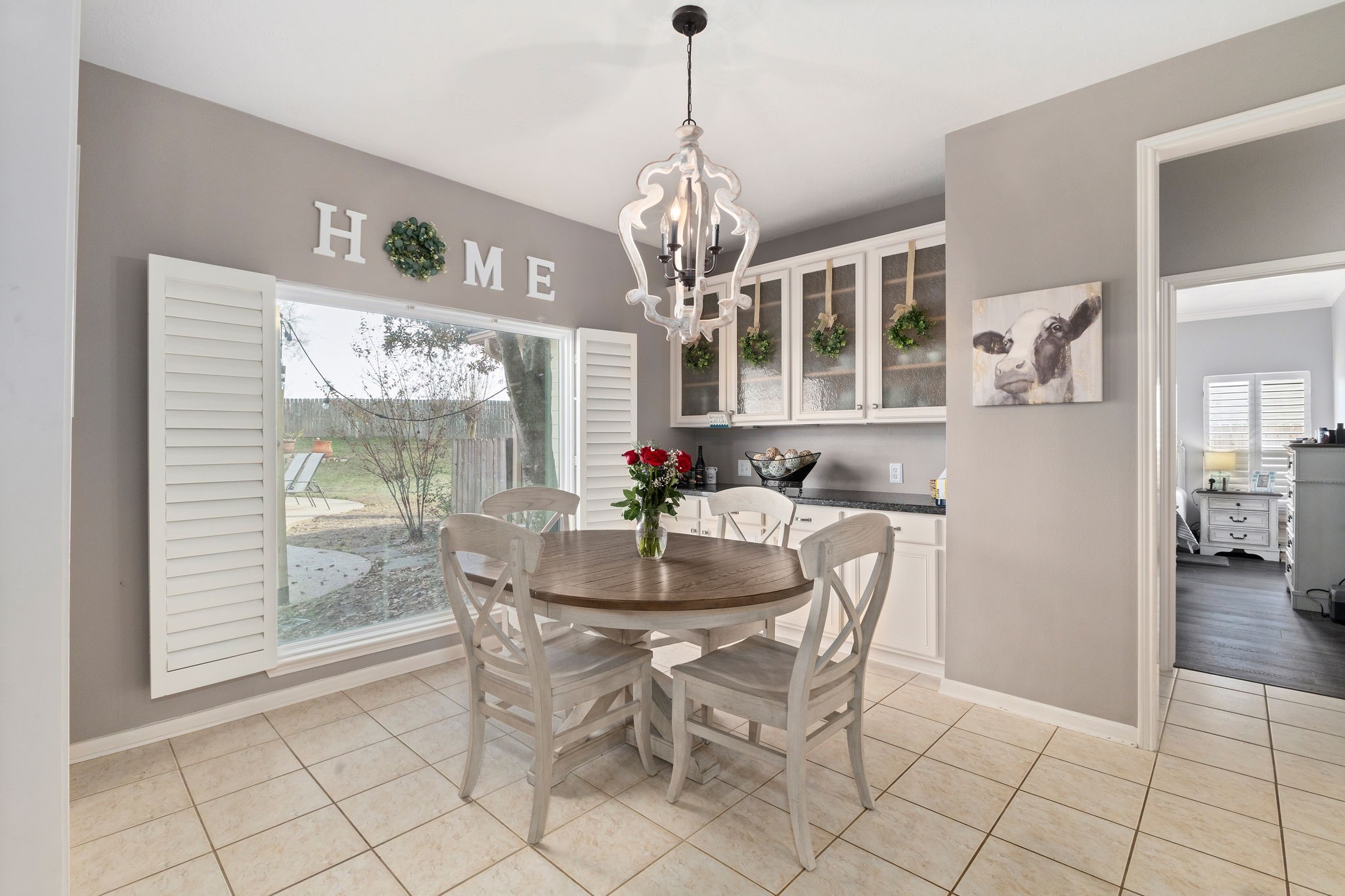 2709 Chase Street Brenham, TX 77833 - Photo 10 of 43 a dining room with furniture a chandelier and wooden floor