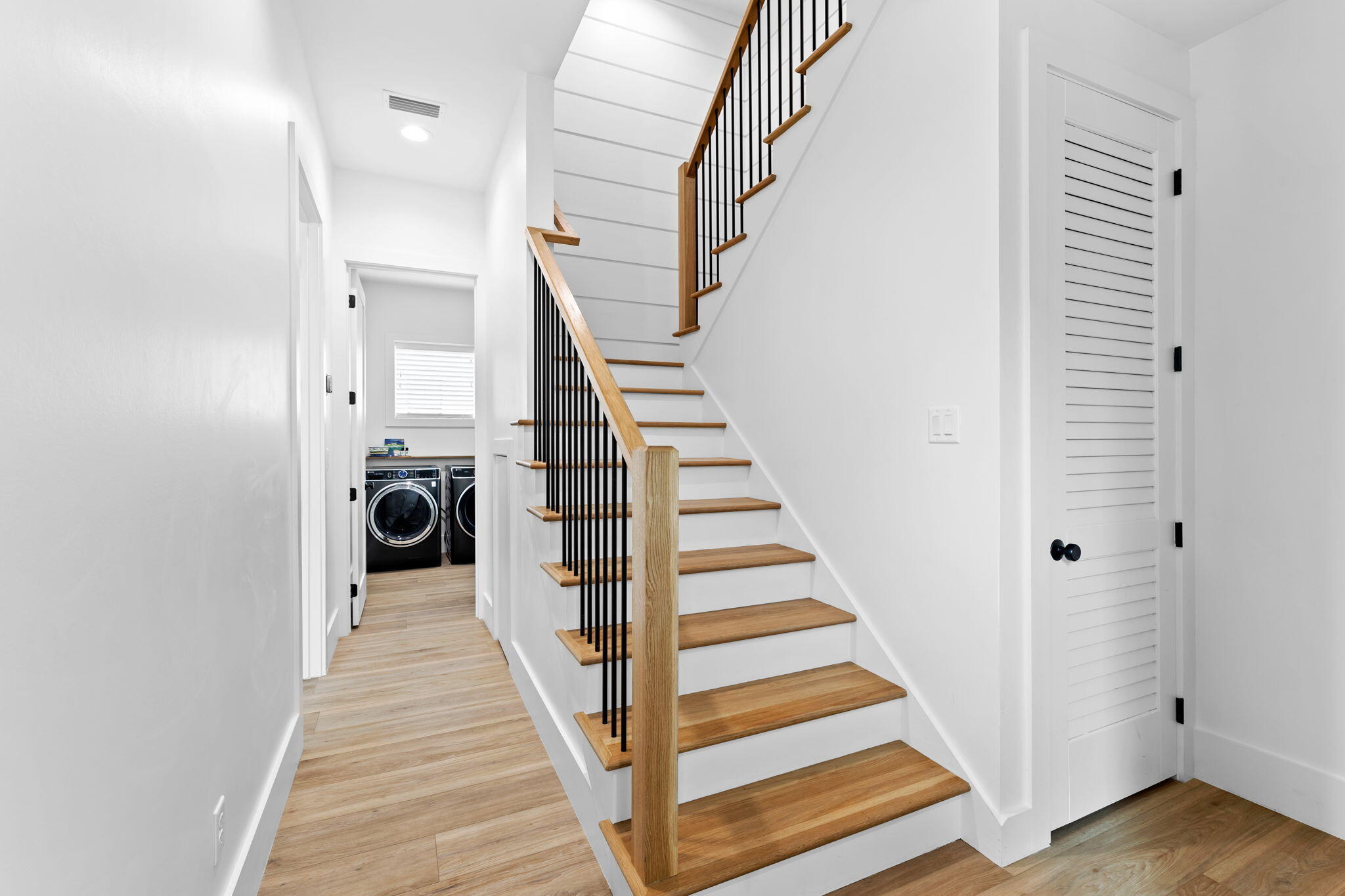 12 Sawgrass Lane Santa Rosa Beach, FL 32459 - Photo 55 of 70 a view of a hallway with wooden floor and entryway