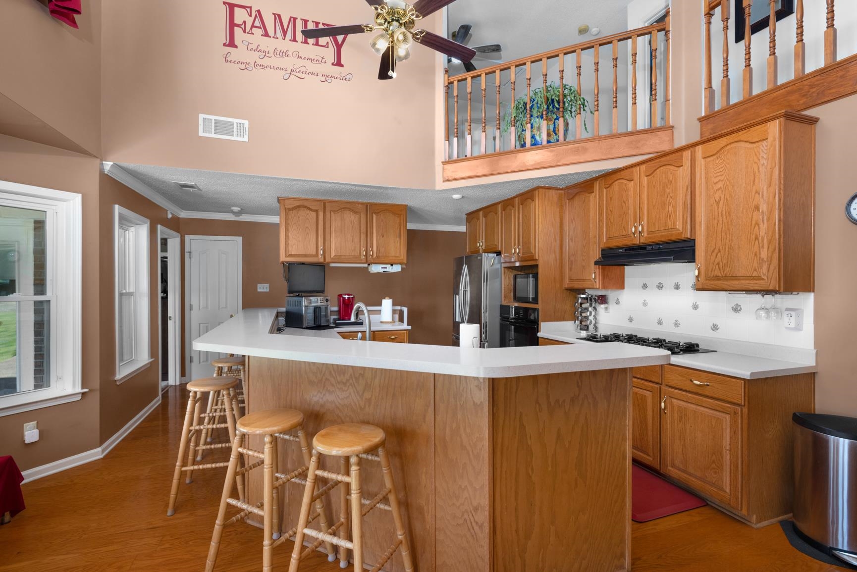 8539 Campground Road Drummonds, TN 38023 - Photo 12 of 38 a kitchen with stainless steel appliances granite countertop a sink refrigerator and cabinets