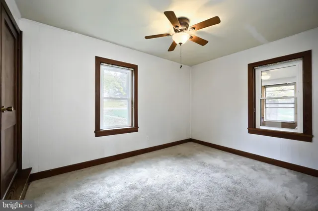 a view of a big room with carpet