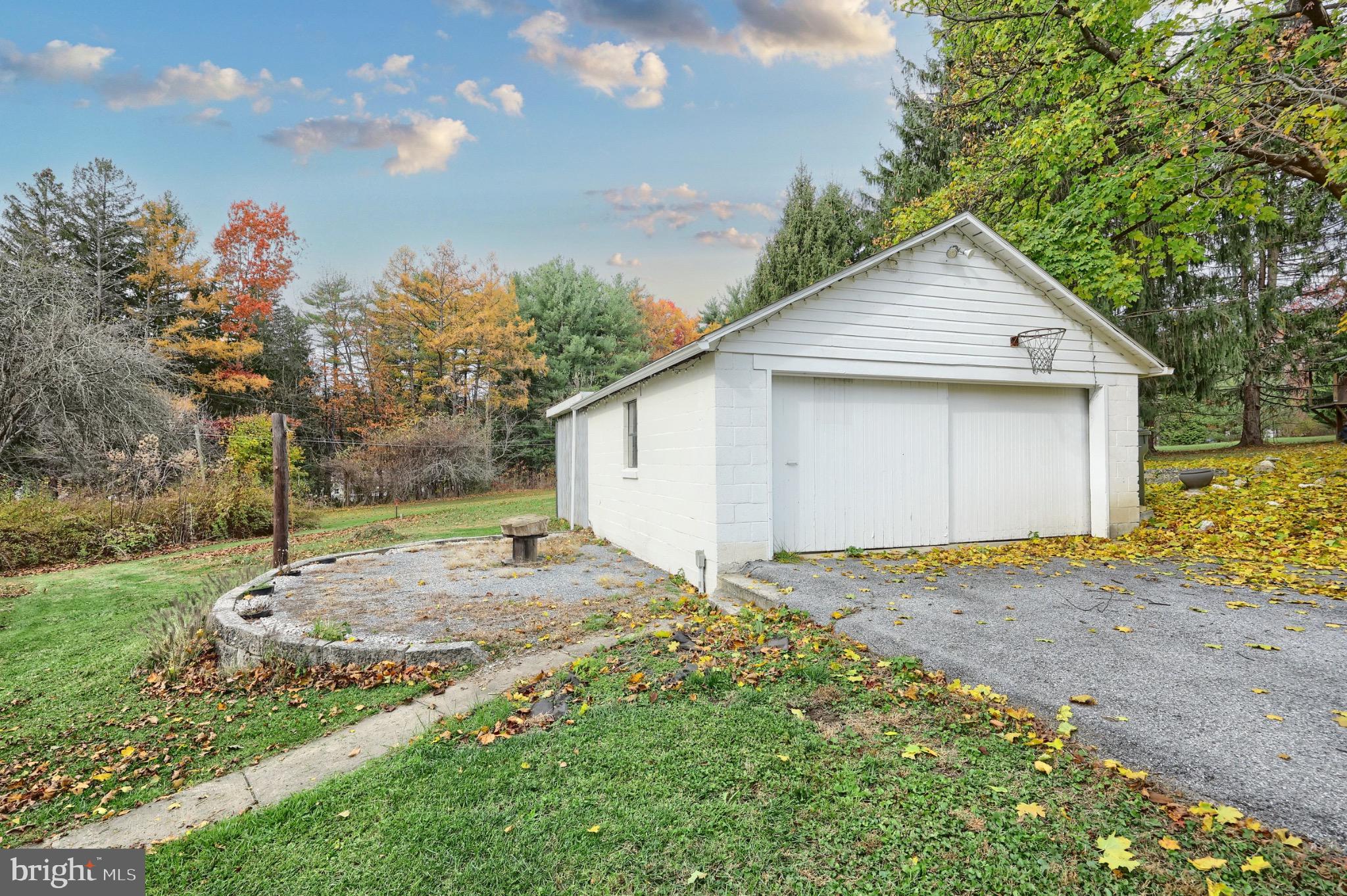 4599 Carlisle Road Gardners, PA 17324 - Photo 32 of 48 Charming garage amidst autumn foliage.