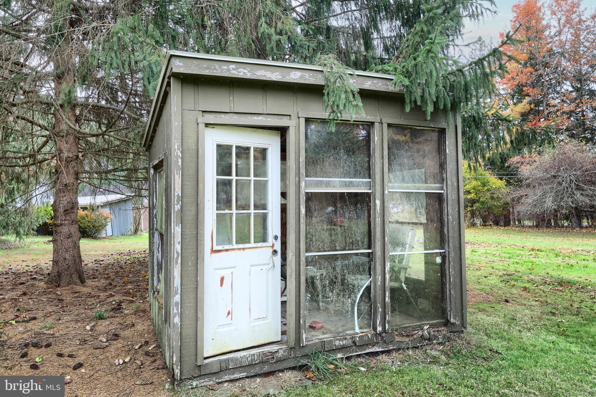 4599 Carlisle Road Gardners, PA 17324 - Photo 35 of 48 Charming garden shed nestled among trees.