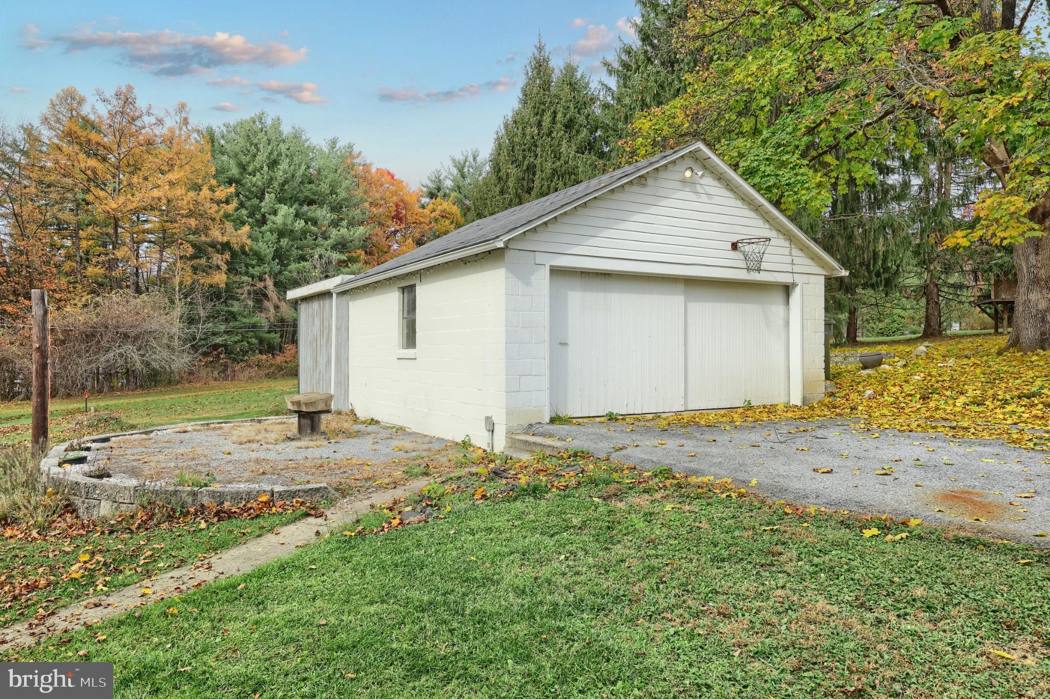 4599 Carlisle Road Gardners, PA 17324 - Photo 38 of 48 Charming garage amidst autumn foliage.
