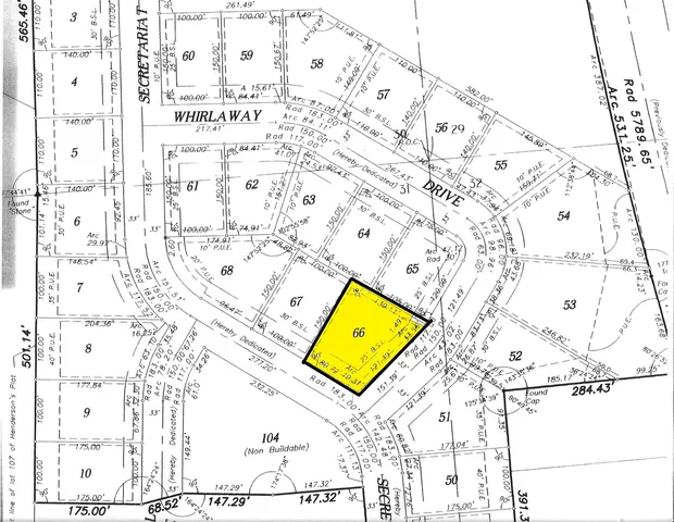 a picture of a room with a white wall and has a street sign on it