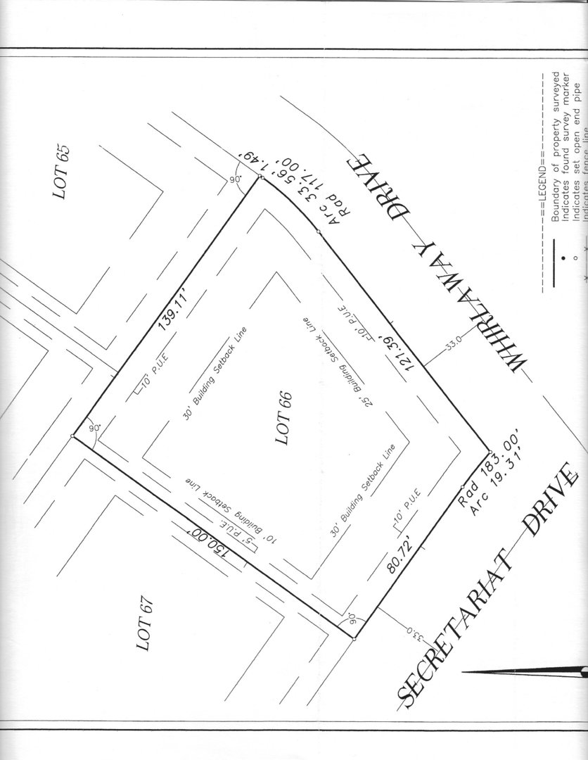 1204 Secretariat Drive Genoa, IL 60135 - Photo 4 of 5 a picture of a room with a white wall and has a street sign on it