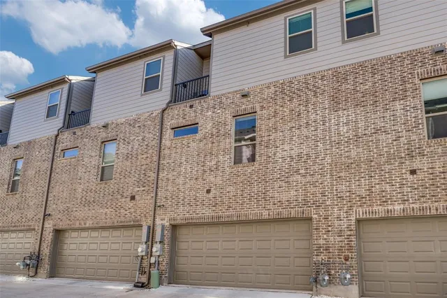 front view of a brick house with an oven
