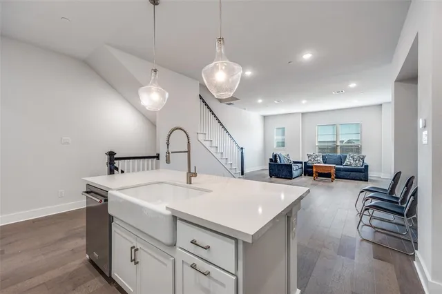 a view of center island and chandelier