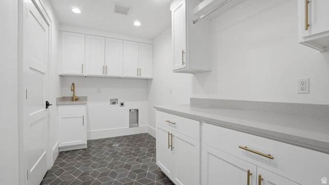 1682 North 1950 W Street, Unit 9 Provo, UT 84604 - Photo 56 of 84 Dedicated laundry space featuring white shaker cabinetry, an integrated sink with a gold-finish faucet, and substantial countertop space