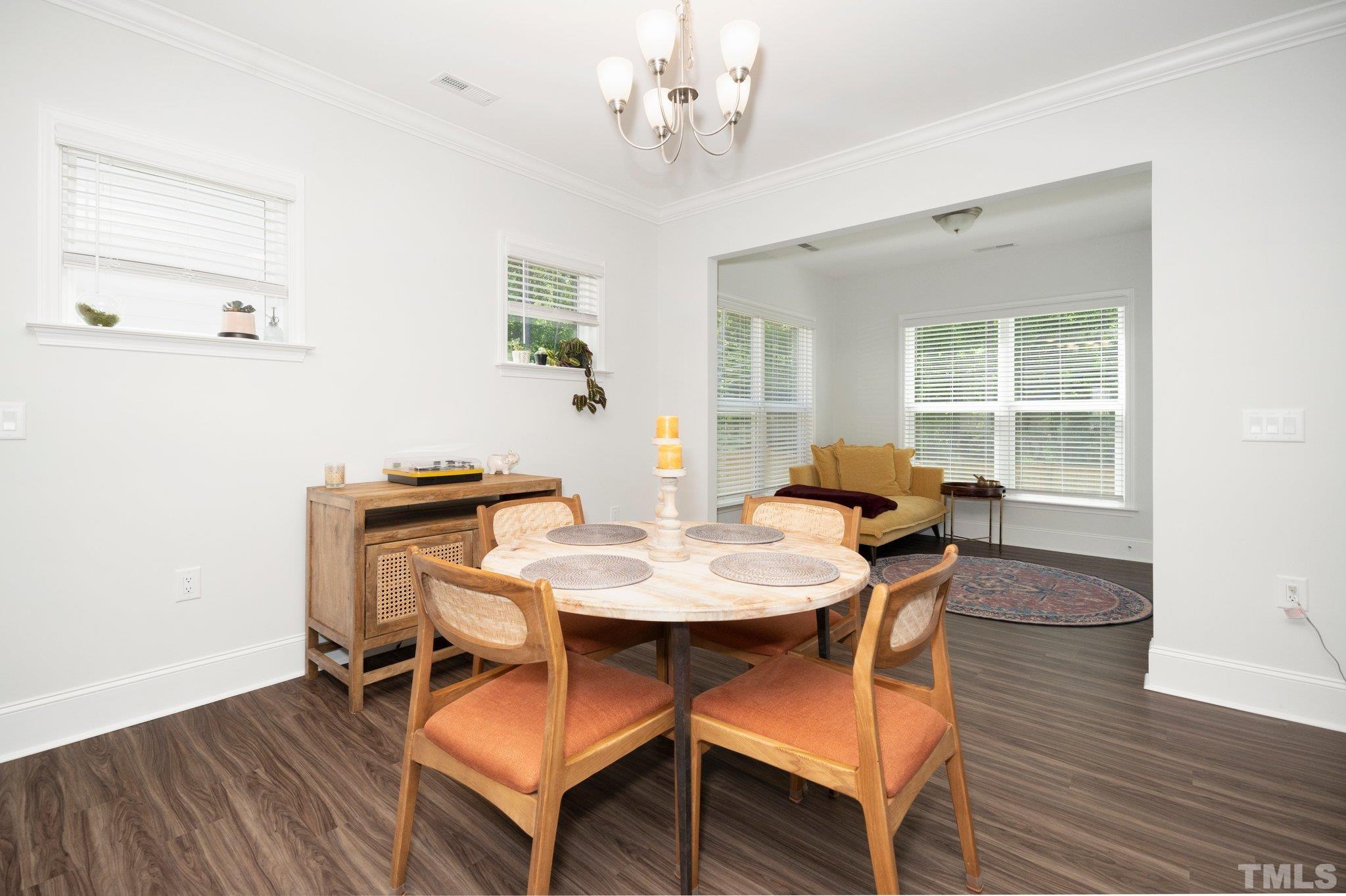 3271 Ripley River Road New Hill, NC 27562 - Photo 17 of 48 a view of a dining room with furniture window and wooden floor