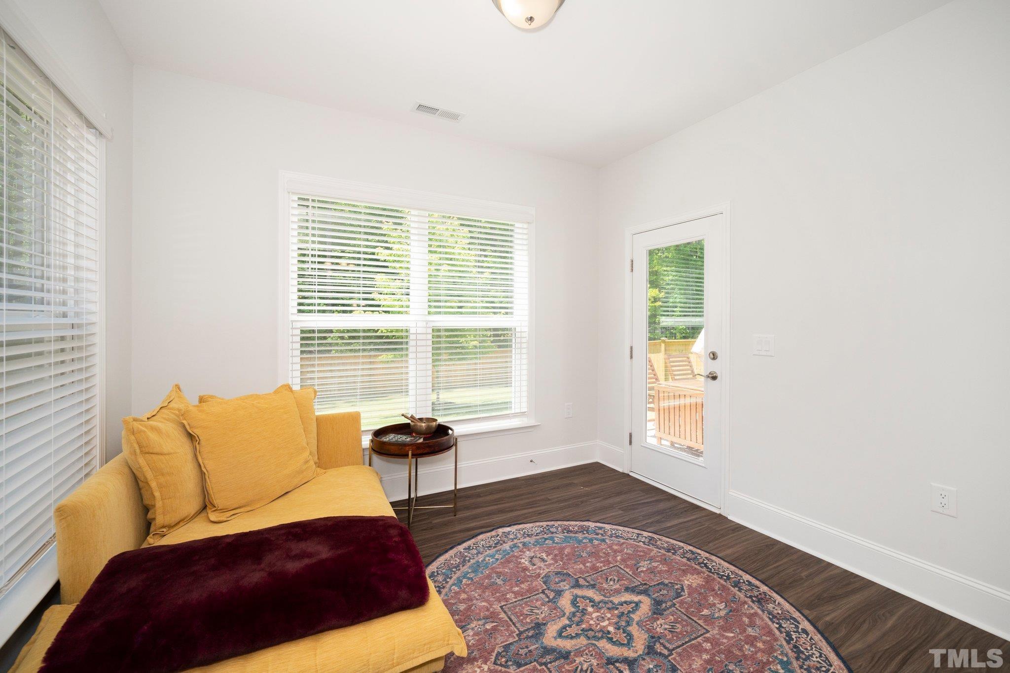 3271 Ripley River Road New Hill, NC 27562 - Photo 19 of 48 a living room with a couch and a window