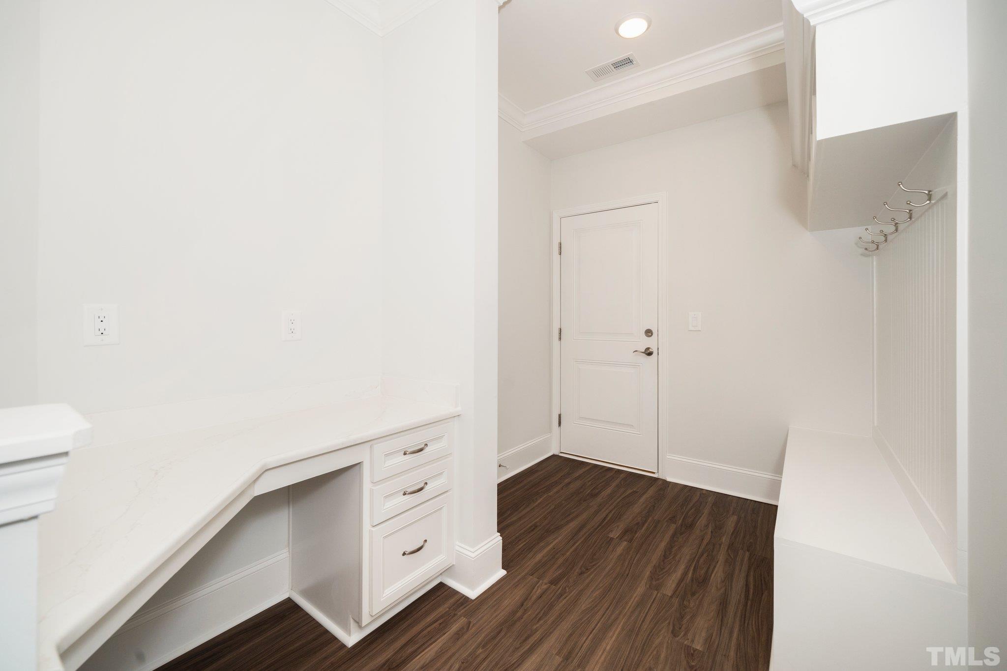 3271 Ripley River Road New Hill, NC 27562 - Photo 24 of 48 a room with white cabinets and wooden floor