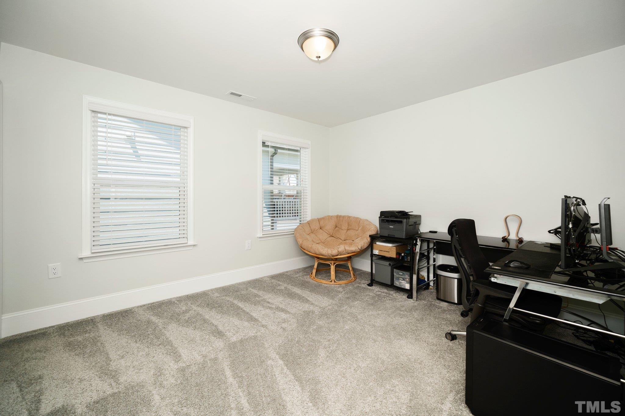 3271 Ripley River Road New Hill, NC 27562 - Photo 26 of 48 a view of a workspace with furniture