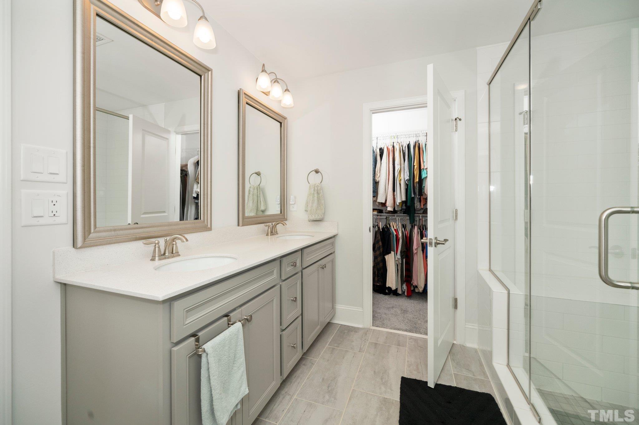 3271 Ripley River Road New Hill, NC 27562 - Photo 34 of 48 a bathroom with a sink vanity and a mirror