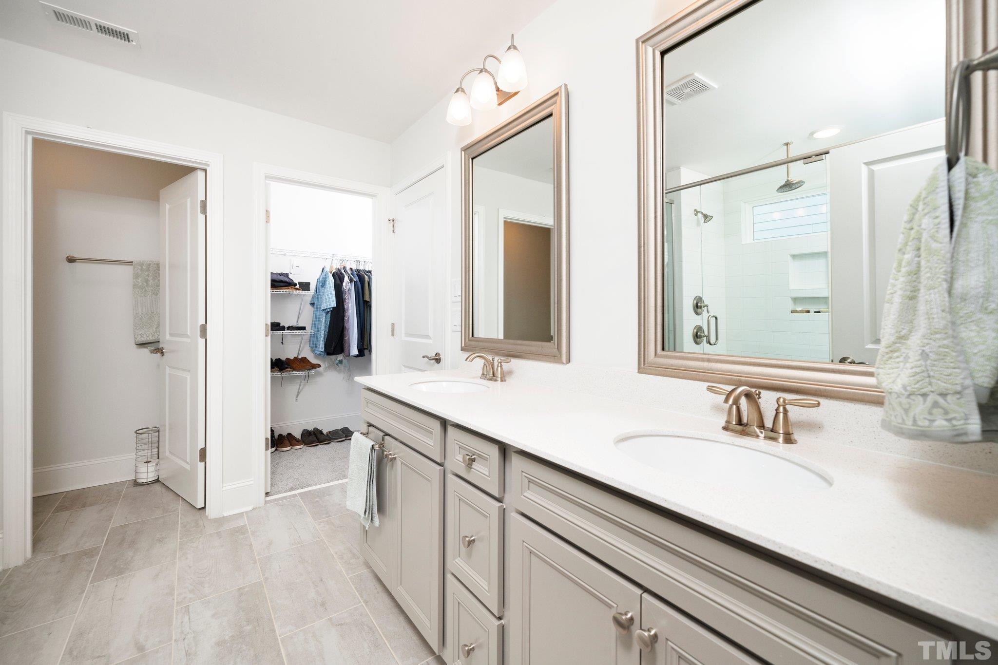 3271 Ripley River Road New Hill, NC 27562 - Photo 35 of 48 a bathroom with a sink and a mirror