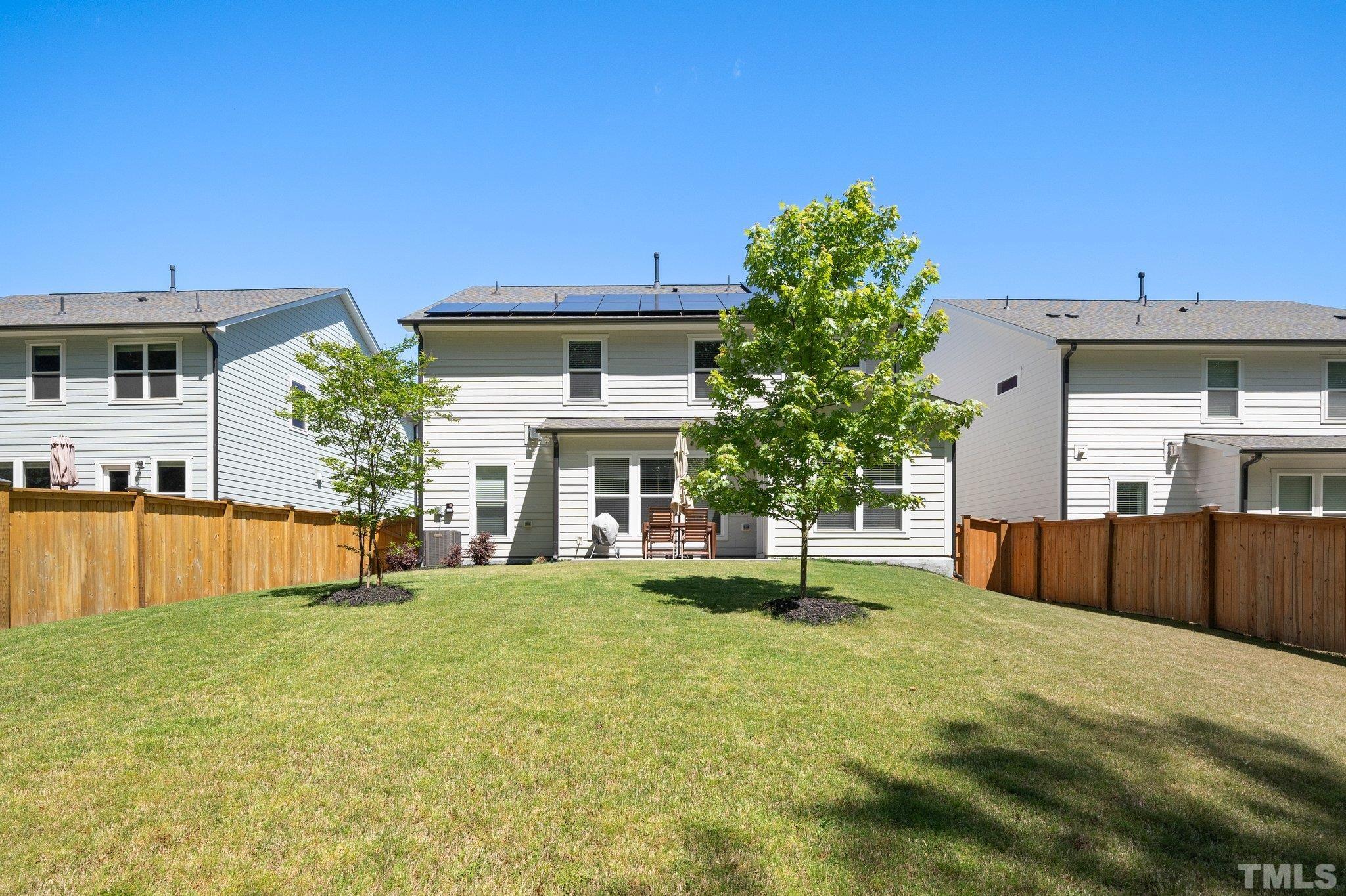 3271 Ripley River Road New Hill, NC 27562 - Photo 38 of 48 a house view with a sitting space and a garden