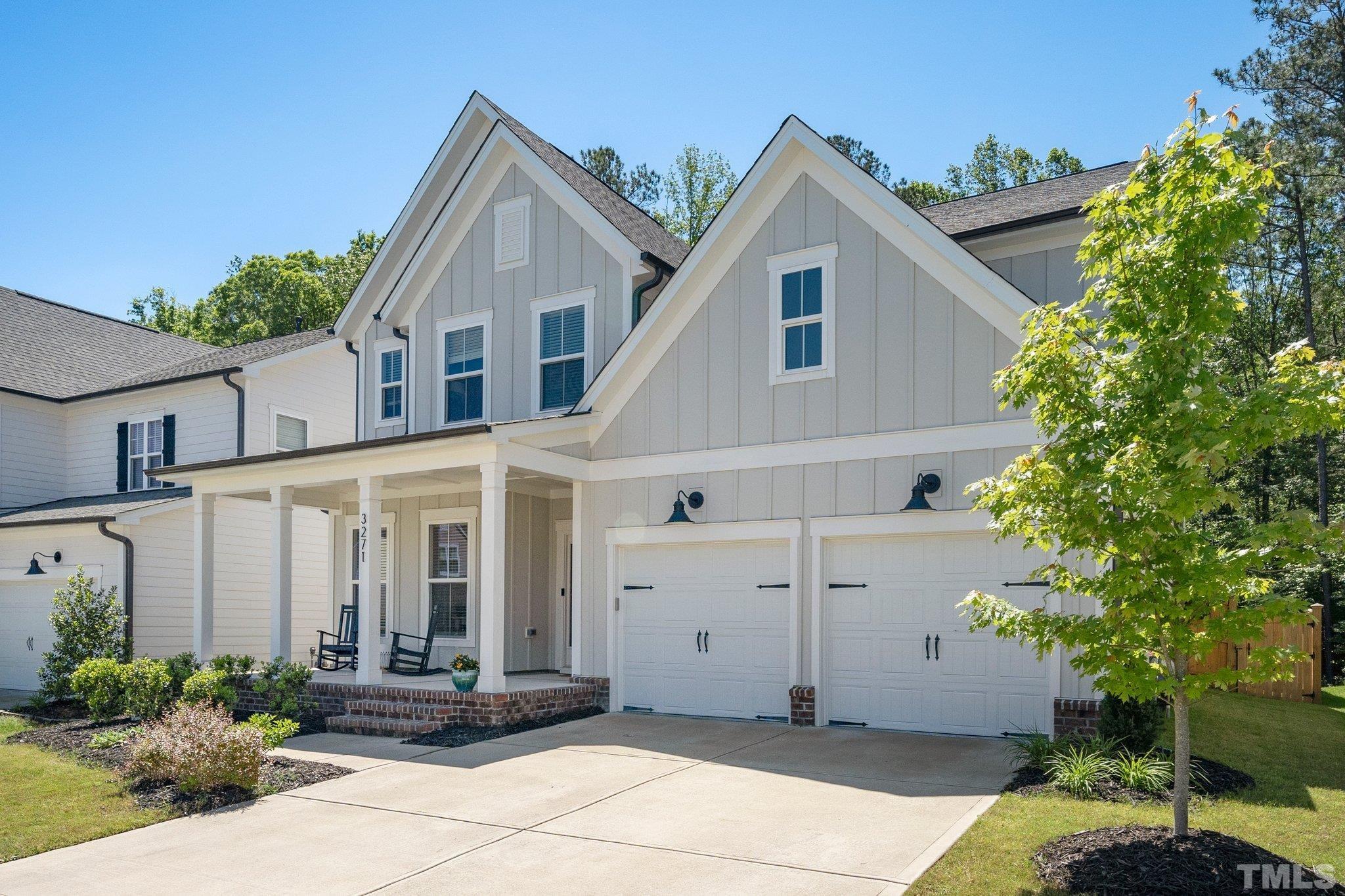 3271 Ripley River Road New Hill, NC 27562 - Photo 46 of 48 a view of a white house next to a yard