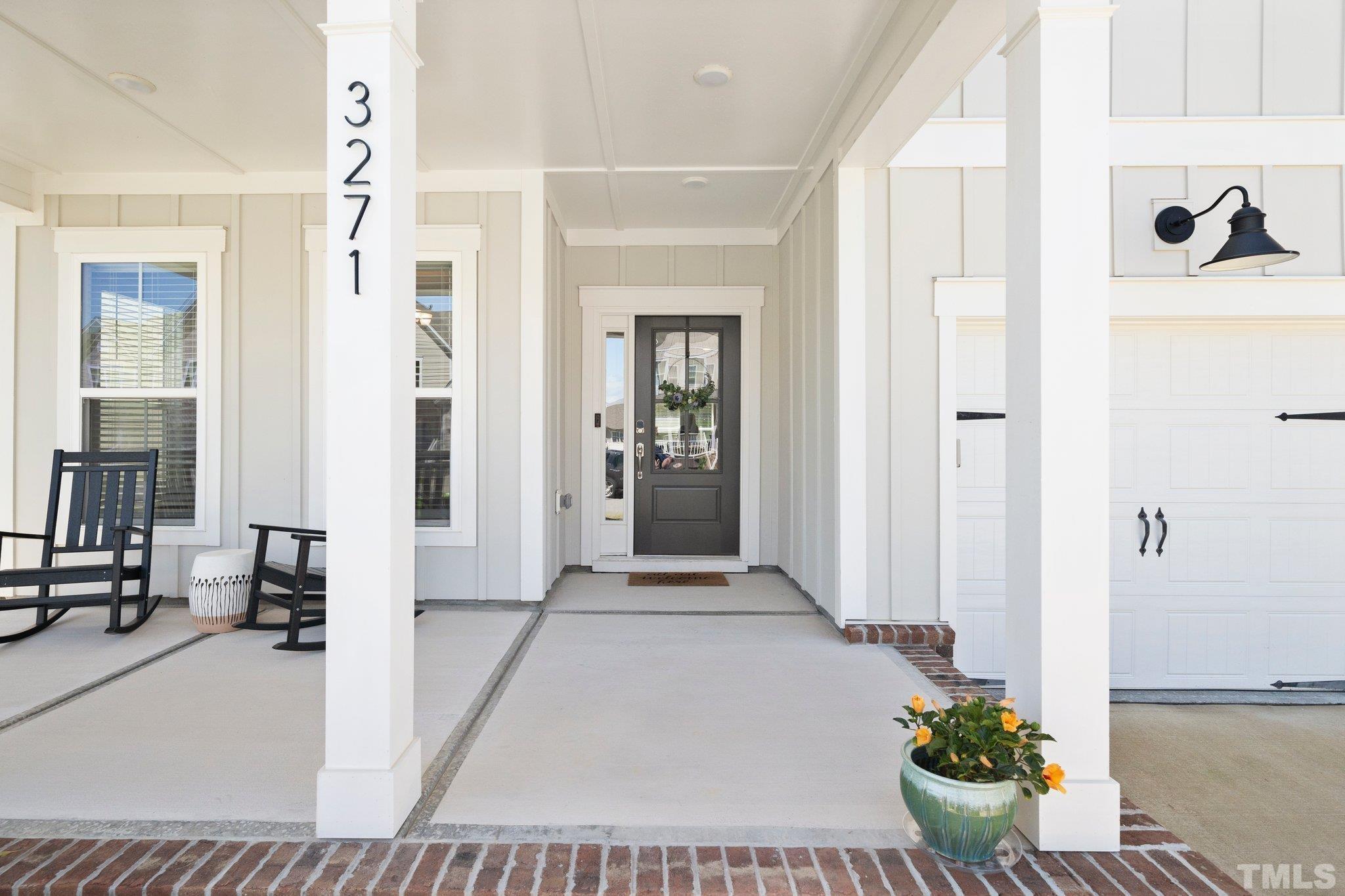 3271 Ripley River Road New Hill, NC 27562 - Photo 5 of 48 a view of a hallway with dining area and glass door