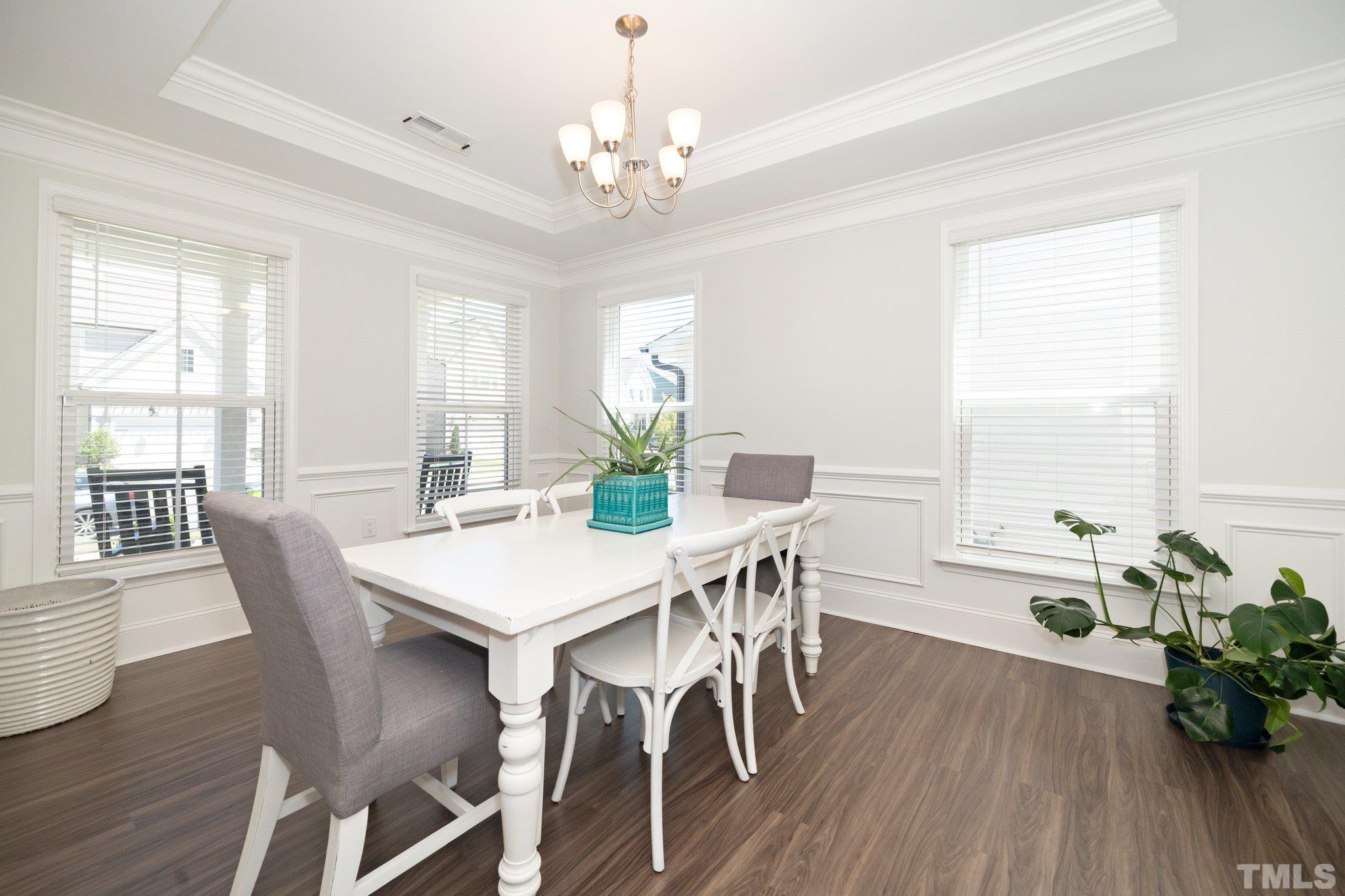 3271 Ripley River Road New Hill, NC 27562 - Photo 7 of 48 a view of a dining room with furniture window and wooden floor