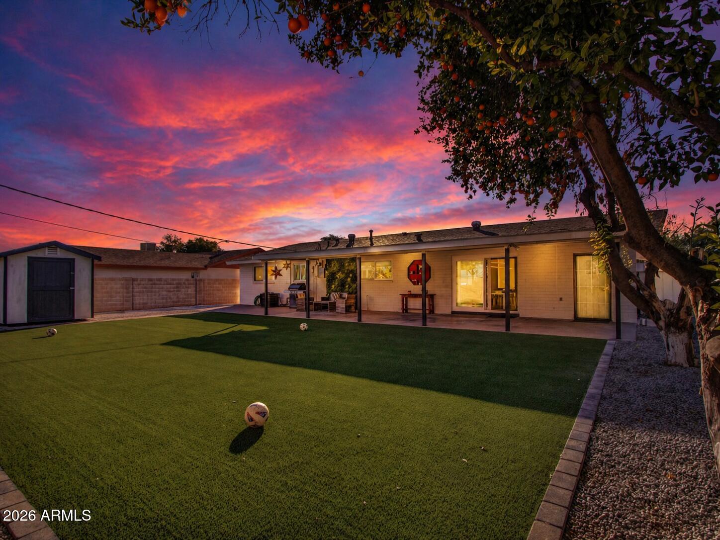 3010 East Yucca Street Phoenix, AZ 85028 - Photo 13 of 58 a view of a big yard with a house in the background
