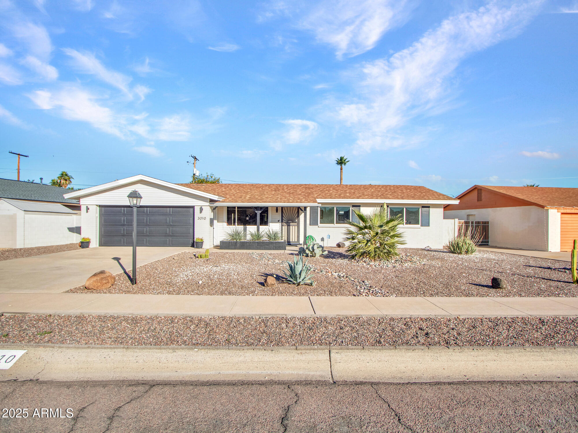 3010 East Yucca Street Phoenix, AZ 85028 - Photo 16 of 58 a front view of a house with a yard