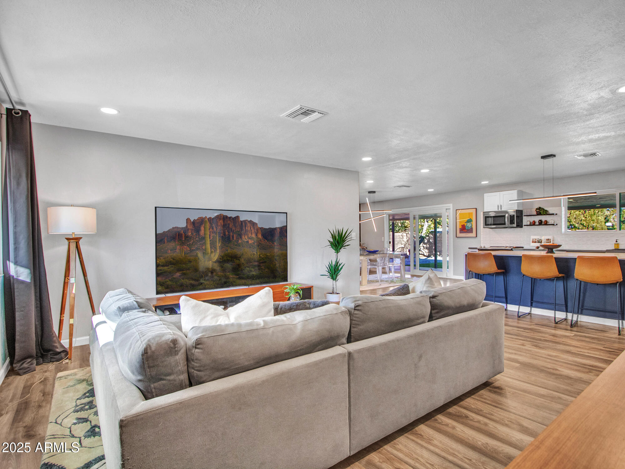 3010 East Yucca Street Phoenix, AZ 85028 - Photo 21 of 58 a living room with furniture and a flat screen tv