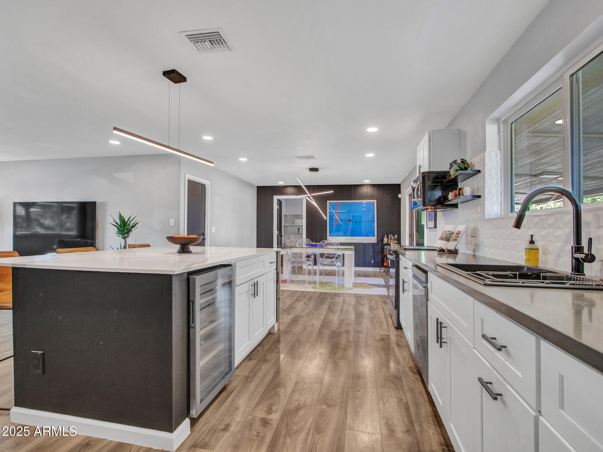 3010 East Yucca Street Phoenix, AZ 85028 - Photo 22 of 58 a kitchen with stainless steel appliances granite countertop a sink and cabinets