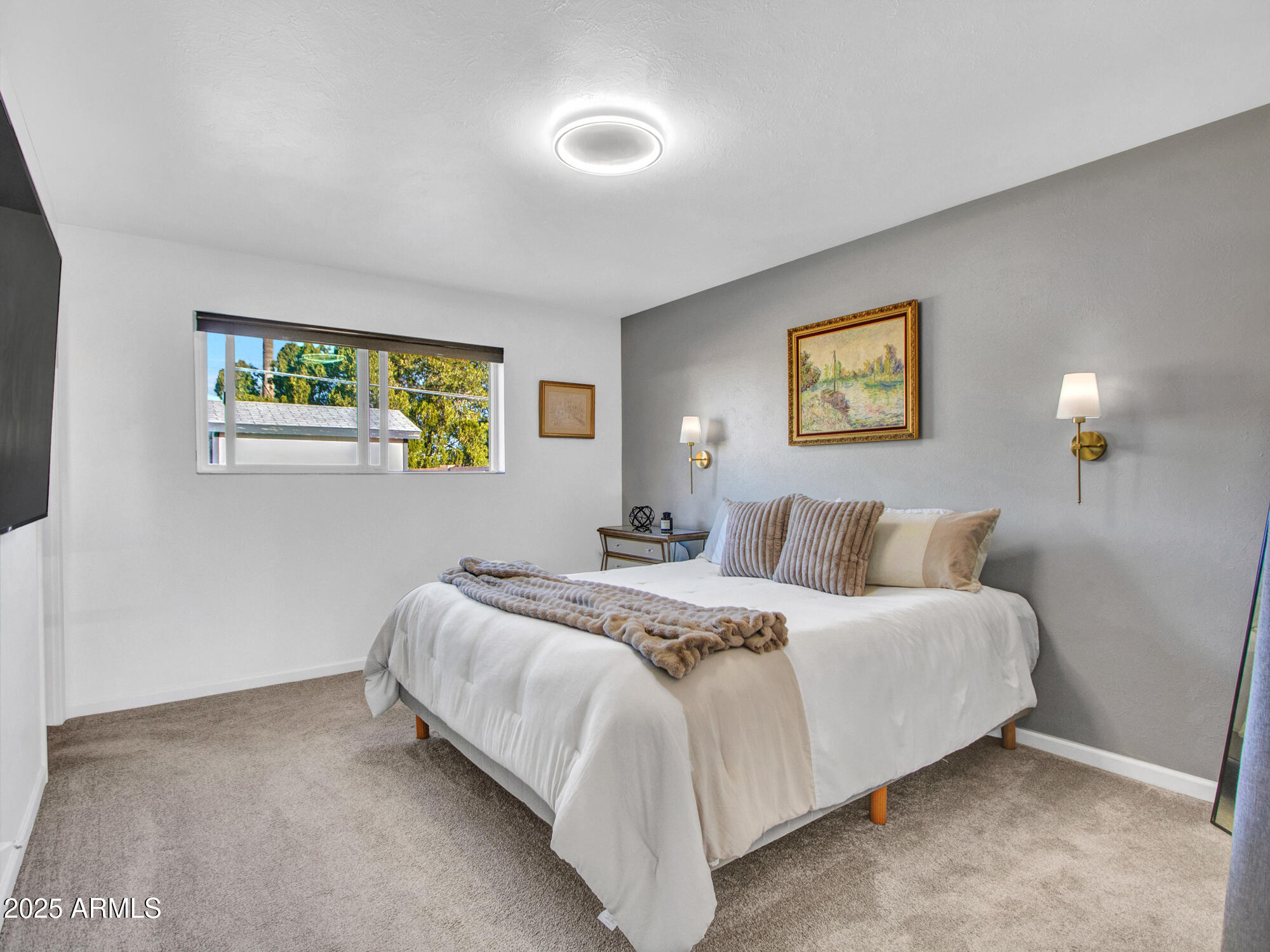 3010 East Yucca Street Phoenix, AZ 85028 - Photo 29 of 58 a bedroom with a bed and painting on the wall