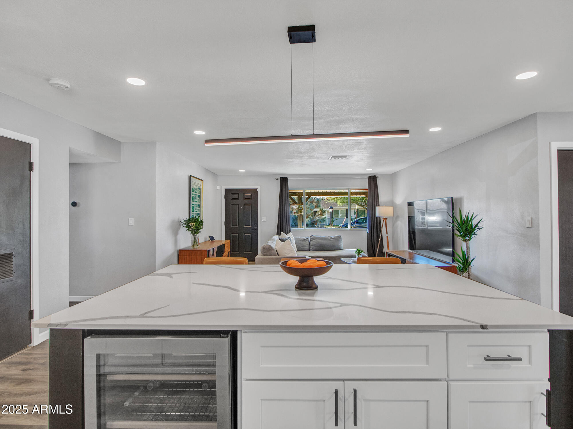3010 East Yucca Street Phoenix, AZ 85028 - Photo 7 of 58 a kitchen with a sink a counter and chairs