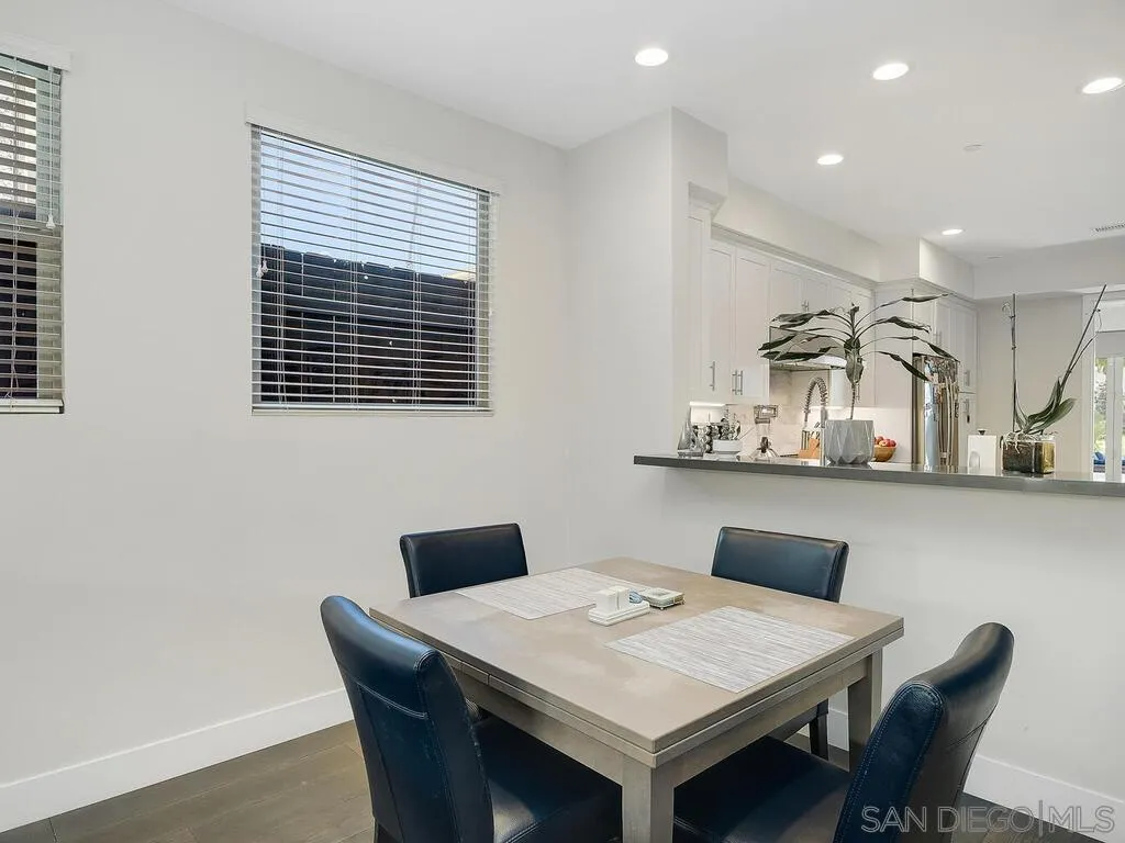 938 Opal Street San Diego, CA 92109 - Photo 15 of 70 a view of a dining room with furniture
