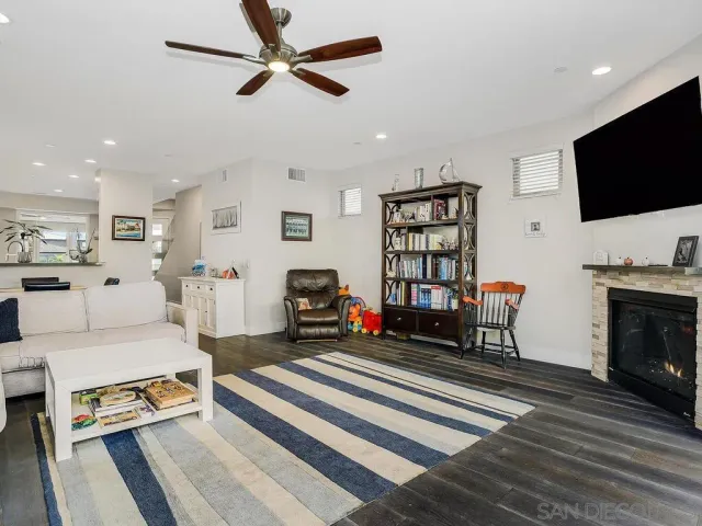 a spacious bedroom with a large bed and a fireplace