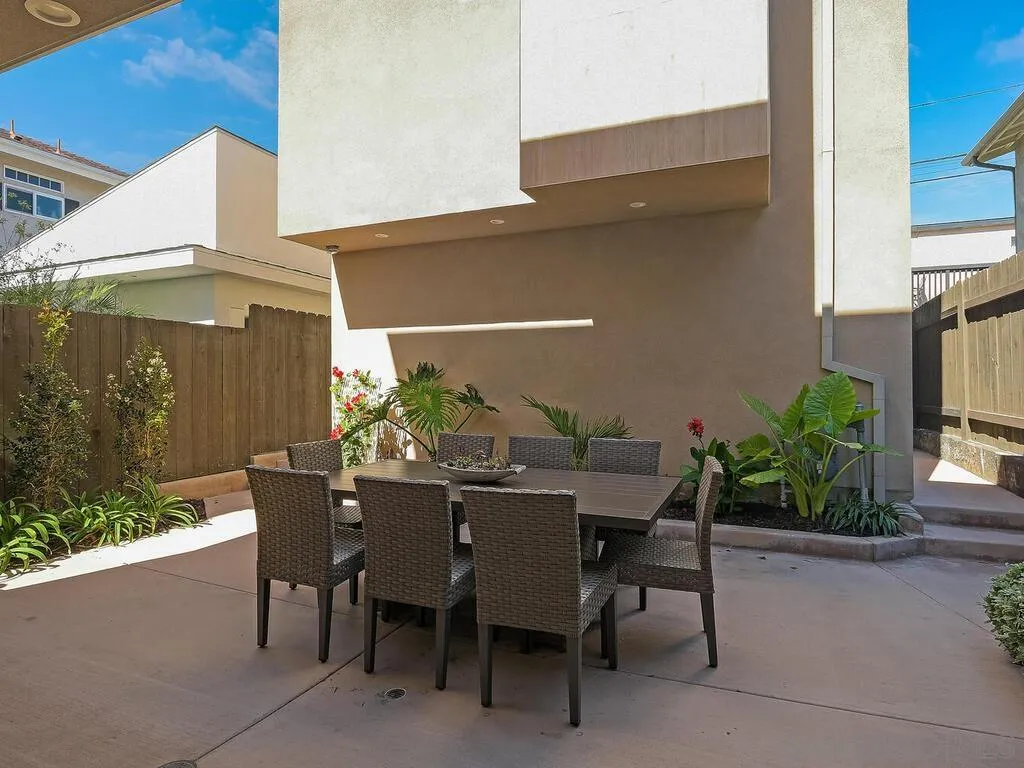 938 Opal Street San Diego, CA 92109 - Photo 20 of 70 a view of an outdoor dining space with a table and chairs