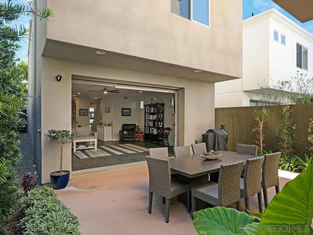 938 Opal Street San Diego, CA 92109 - Photo 21 of 70 a view of a dining room and chairs and table in a patio