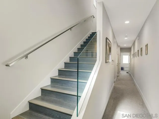 a bedroom with a bed and a dresser in it