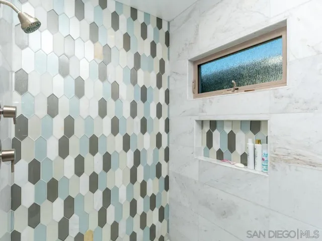 a living room with furniture a lamp and a fireplace