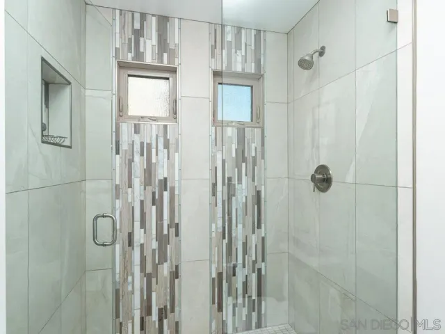 a kitchen with stainless steel appliances granite countertop a refrigerator stove microwave and sink