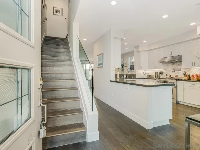 a view of an entryway with wooden floor