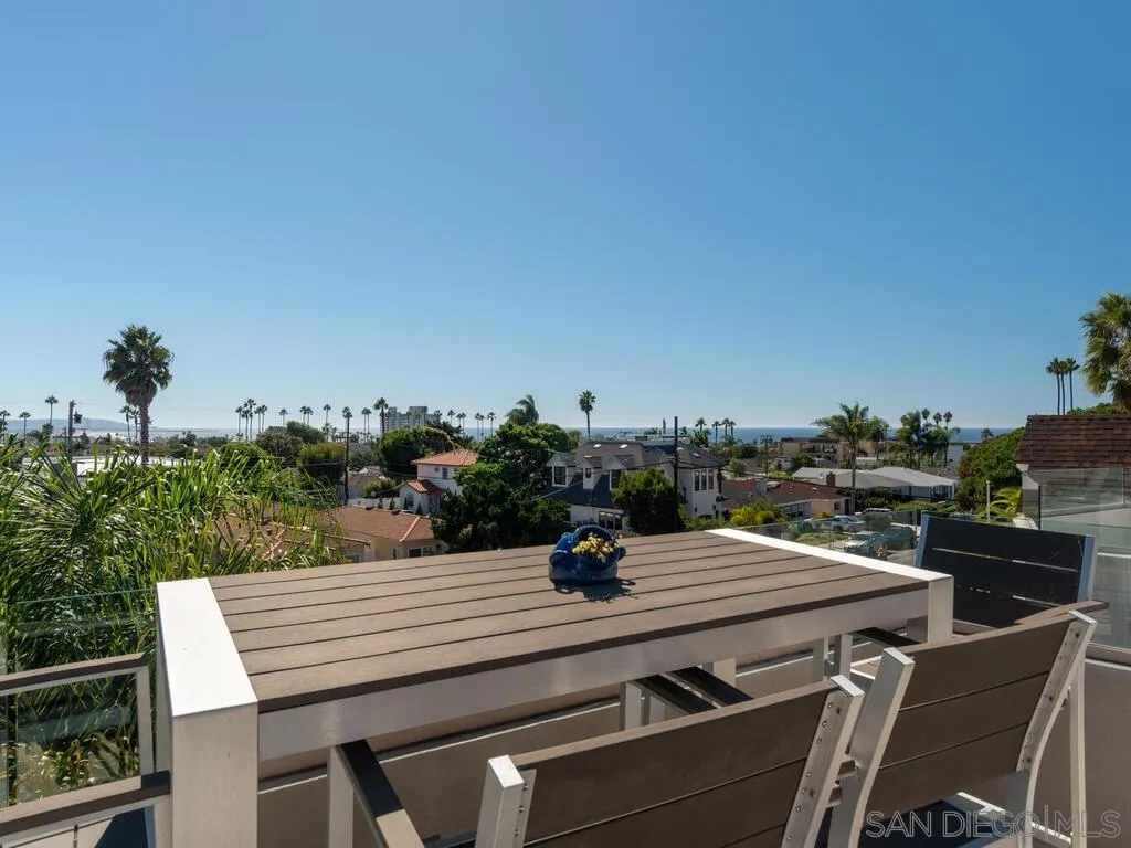 938 Opal Street San Diego, CA 92109 - Photo 42 of 70 a view of a terrace with a table and chairs