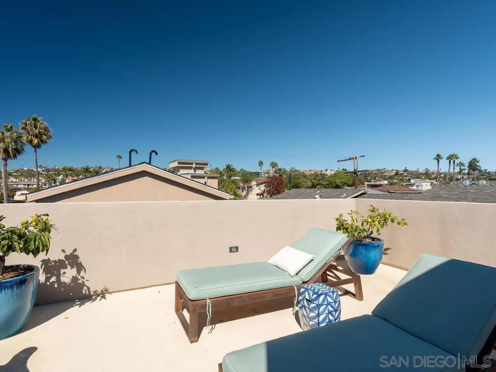 938 Opal Street San Diego, CA 92109 - Photo 43 of 70 a terrace of a house with outdoor seating