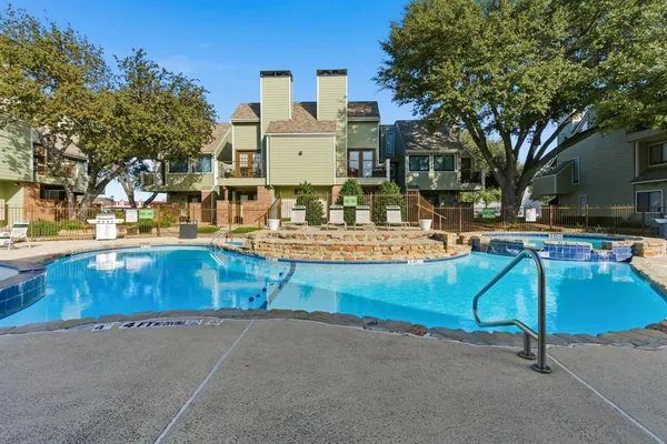 a swimming pool with outdoor seating and yard