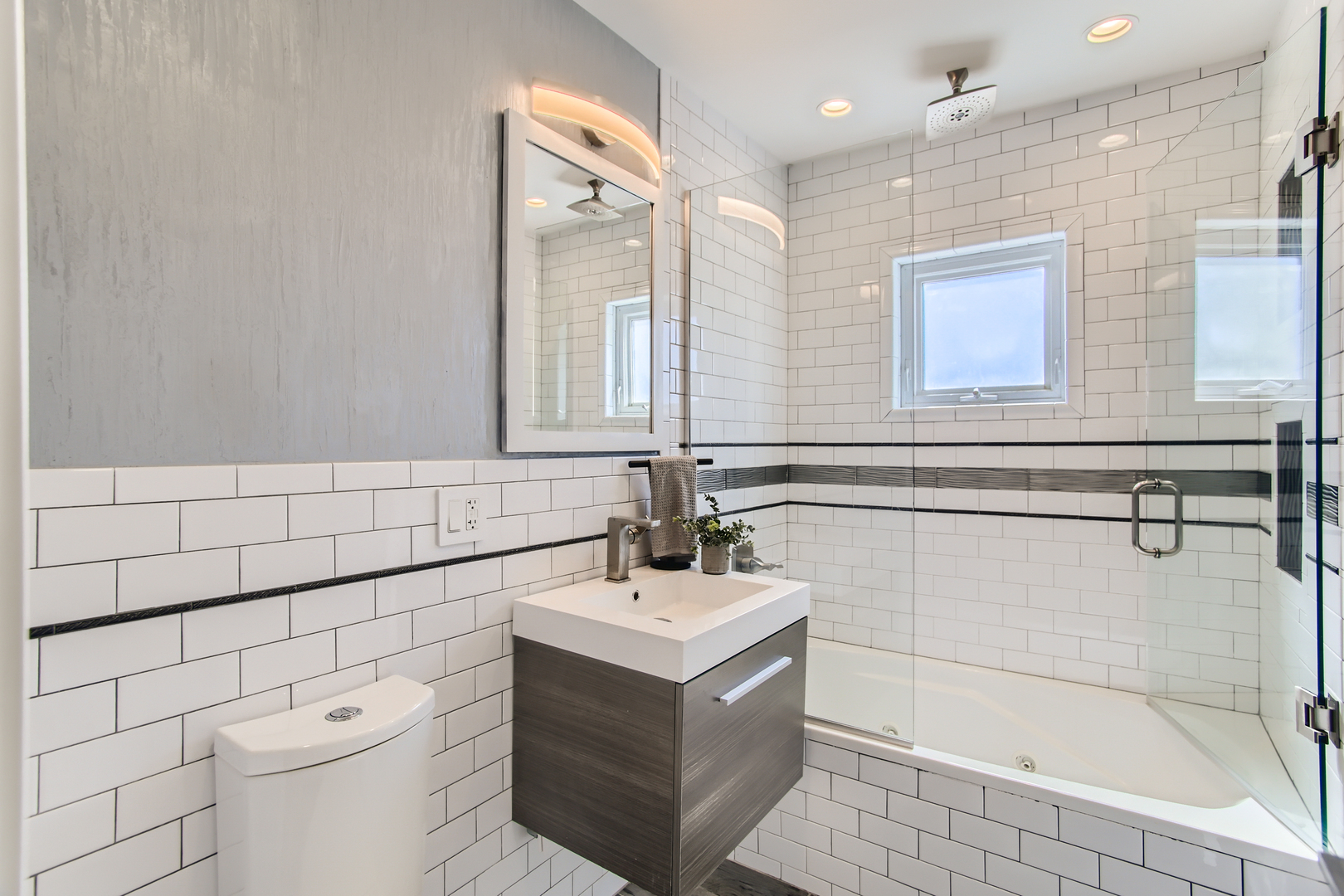 100 Highview Avenue Addison, IL 60101 - Photo 17 of 28 a bathroom with a sink mirror vanity and toilet
