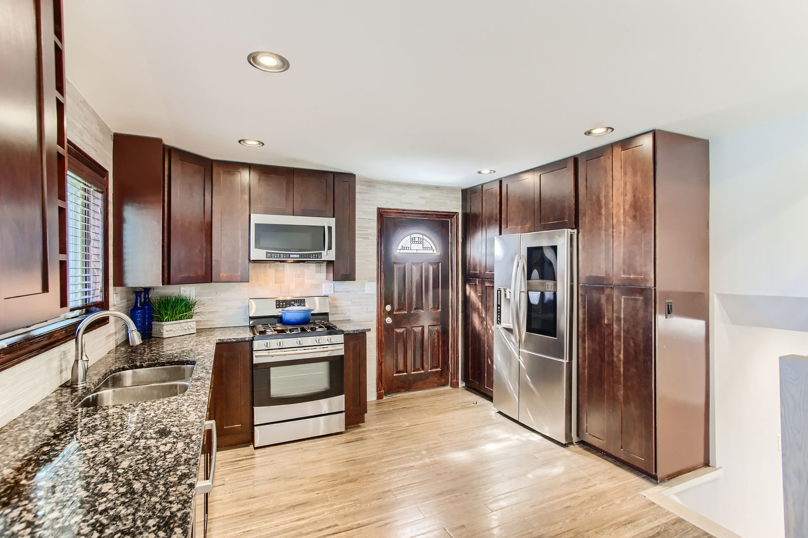 100 Highview Avenue Addison, IL 60101 - Photo 4 of 28 a kitchen with stainless steel appliances granite countertop a refrigerator stove and oven