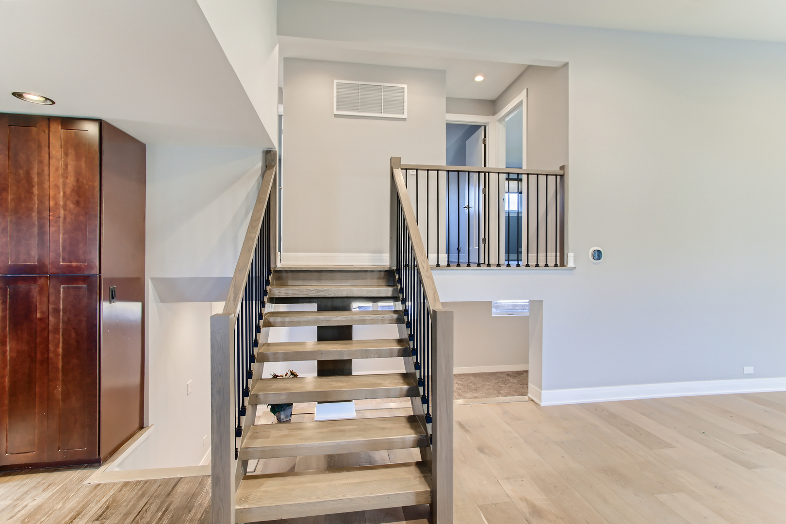 100 Highview Avenue Addison, IL 60101 - Photo 8 of 28 a view of staircase with wooden floor and white walls