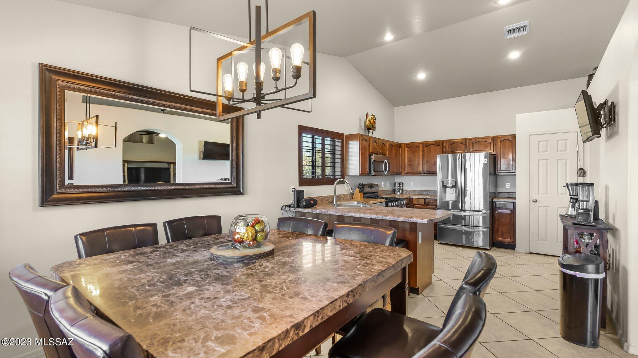 96 Calle Quintana Rio Rico, AZ 85648 - Photo 15 of 30 a large kitchen with a table and chairs