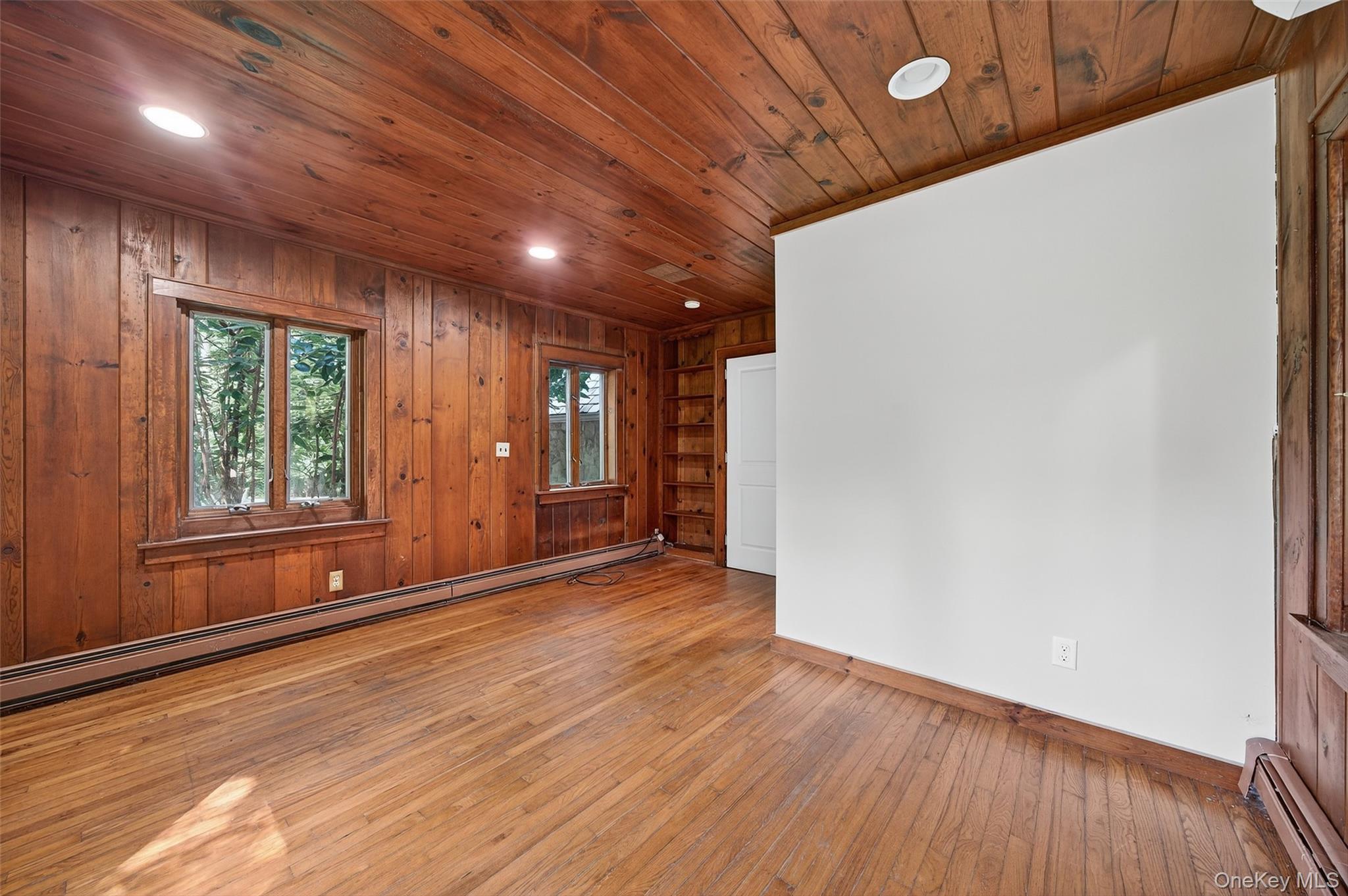 91 Sleepy Valley Road Warwick, NY 10990 - Photo 16 of 30 a view of an empty room with wooden floor and a window