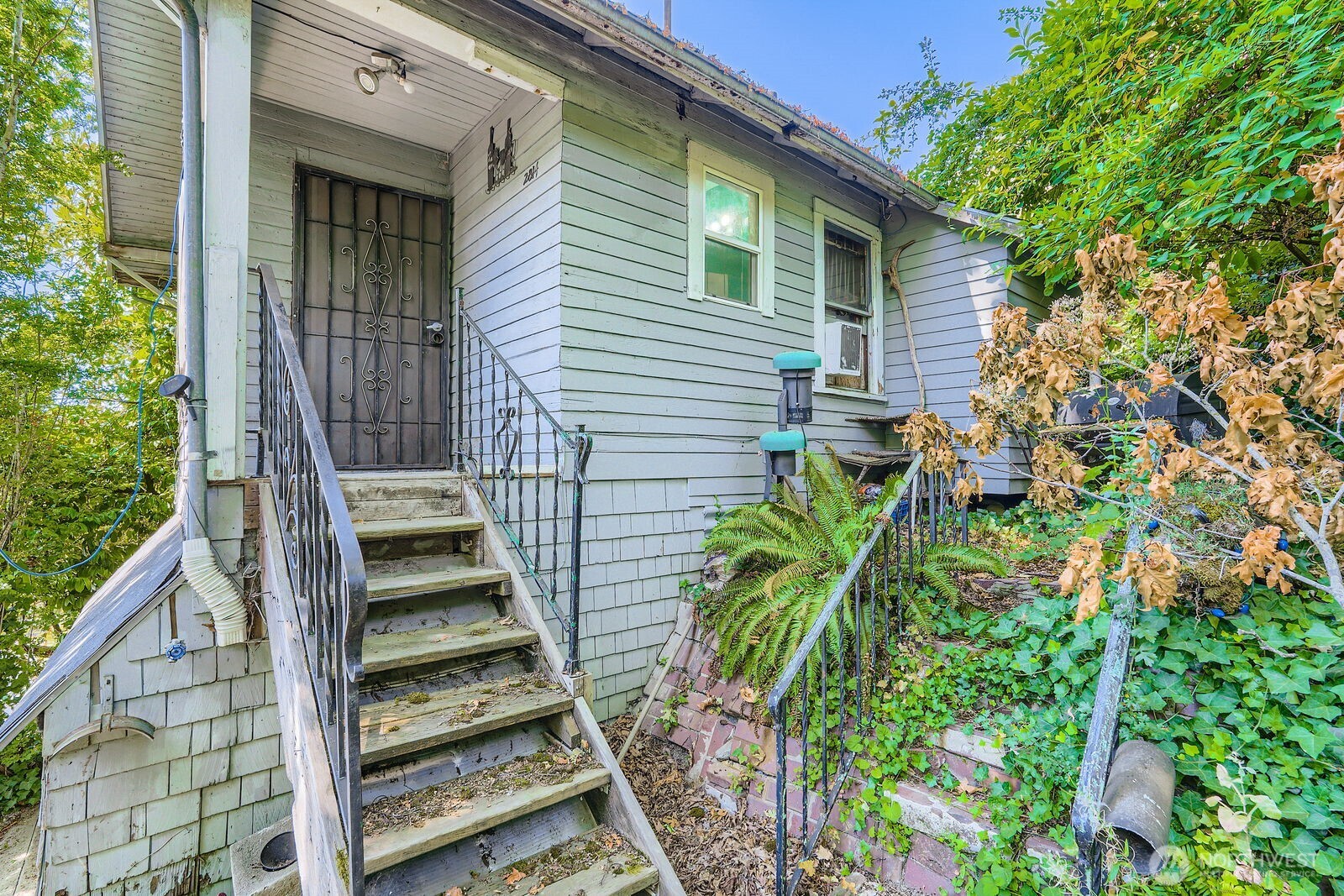 2814 South Grand Street Seattle, WA 98144 - Photo 3 of 23 a view of a house with backyard and wooden fence