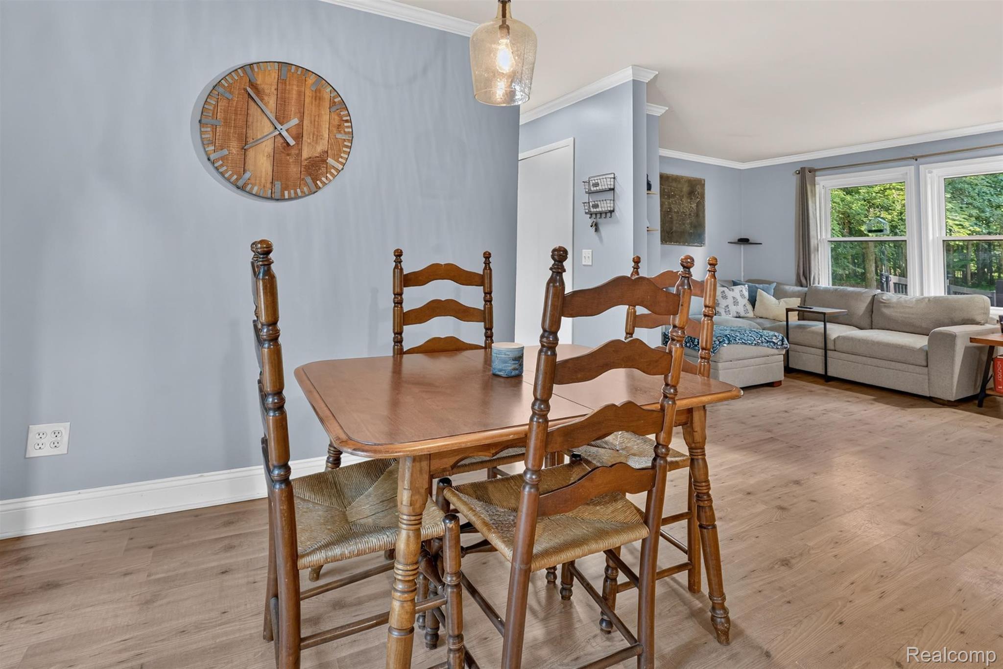 8696 West Sargent Road Fowlerville, MI 48836 - Photo 11 of 36 Light wood-finish flooring throughout, complemented by pale blue wall paint and white trim