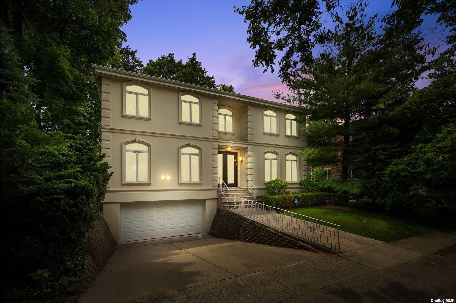 a front view of a house with yard